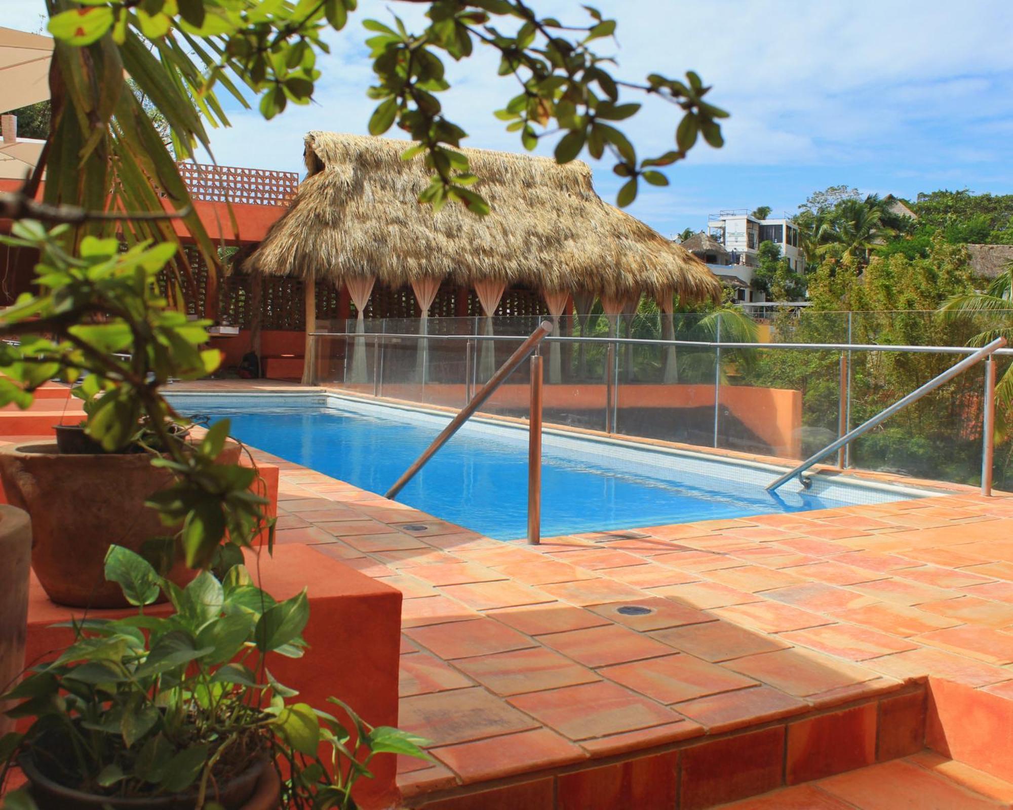 Отель Casa Pepe Саюлита Экстерьер фото Rooftop pool at Hotel Xel-Há